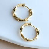 Renzo Twisted hoops earrings in gold